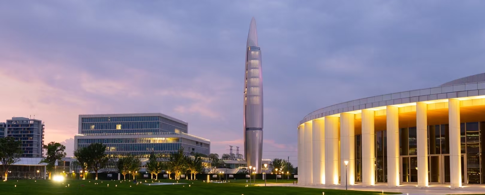 Westlake University's Yungu Campus at dusk, with the landmark tower and illuminated Academic Hall